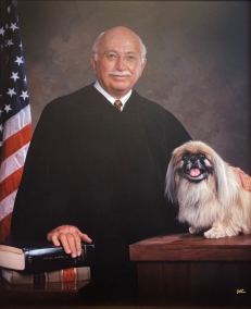 The Honorable J. Bonner Dorsey in his Judicial robe with his dog